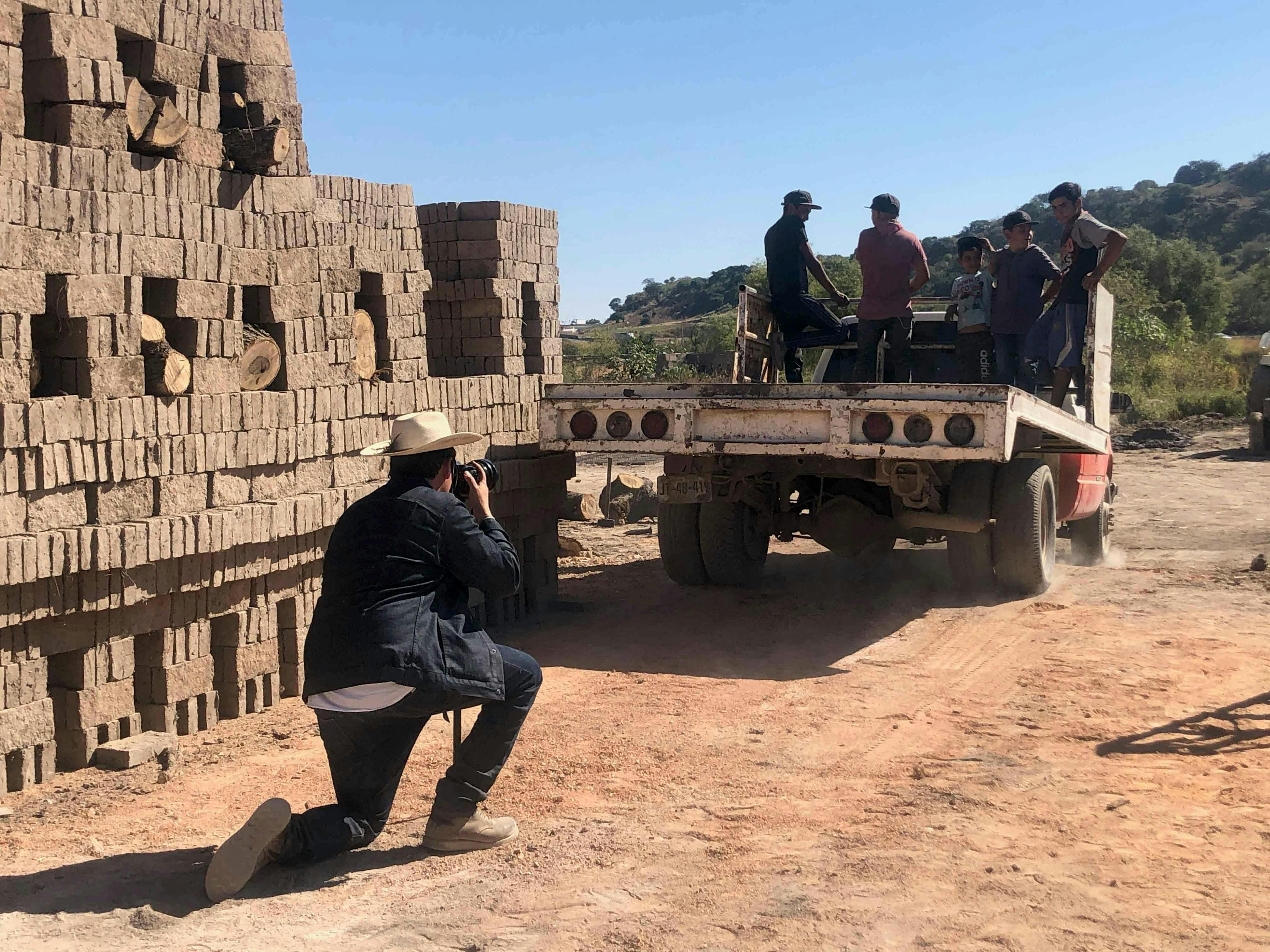 Almanza Pereda photographing the kiln assembly crew in Magdalena.